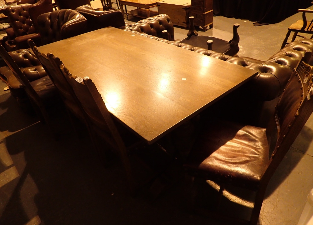 Large oak trestle dining table with four