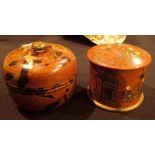 Two lidded Oriental papier mache pots