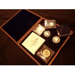 Four coins cased in mint condition Missi