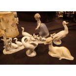 Five Lladro figurines including geese and a faun