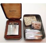 Vintage Oxo tin with lighters and a further boxed lighter