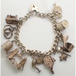 Hallmarked silver charm bracelet with ten charms some unmarked 53g