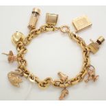 9ct yellow gold charm bracelet with nine charms 22g