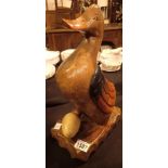 Large carved wood duck with egg H: 60 cm