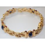 14ct gold bracelet with rub over sapphires and diamonds 24.