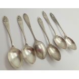 Six hallmarked silver teaspoons with bowling figurines to handle