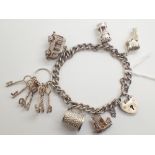 Sterling silver charm bracelet with six charms 39g