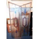 Pair of stained glass windows with etched decoration