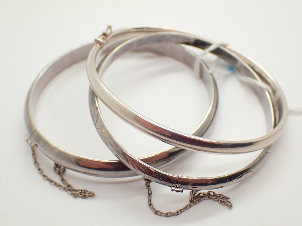 Three silver vintage style hinged bangles