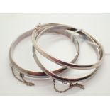 Three silver vintage style hinged bangles