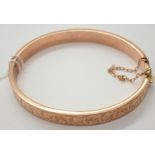 9ct yellow gold ladies bangle with safety chain 8.