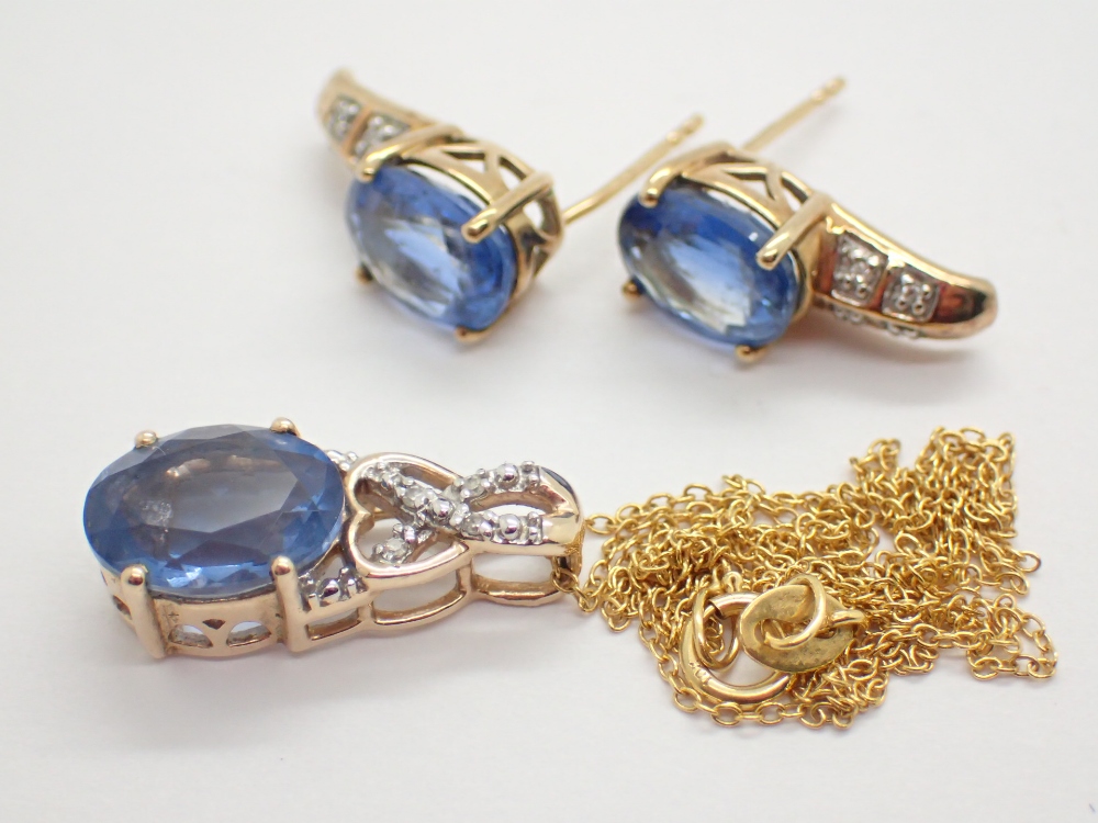 10K gold ( hallmarked as 9ct ) blue stone and diamond earring and pendant set including 10K gold