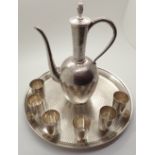 Silver Japanese planished Saki set with tray marked silver to base with six cups and Saki decanter