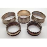 Five hallmarked silver napkin rings including two pairs 58g