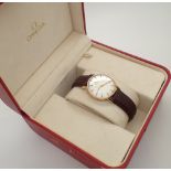Gents 9ct gold Omega automatic wristwatch on brown strap recently serviced with original inner and
