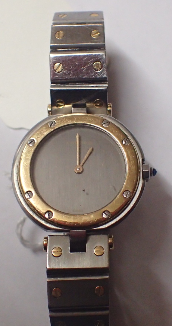 Ladies Cartier stainless steel wristwatch with matching strap and yellow metal bezel