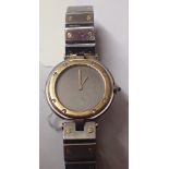 Ladies Cartier stainless steel wristwatch with matching strap and yellow metal bezel