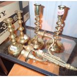 Two pairs of brass candlesticks and a wall mounted example