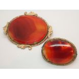 Two antique pinchbeck mounted polished agate brooches