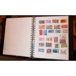 Album of mint stamps and first day covers