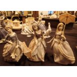Three Lladro figurines of girls with umbrellas