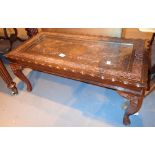 Carved hardwood Oriental style coffee table with brass inlay
