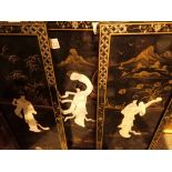 Three Oriental black lacquered plaques with mother of pearl figural design