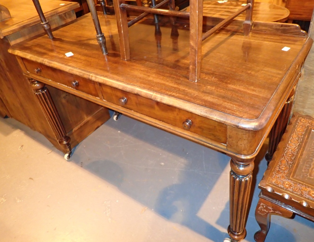 Mahogany side table with two drawers on fluted tapering supports 120 x 56 x 75 cm H