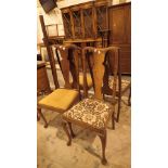 Four Queen Anne style oak upholstered dining chairs with cabriole legs