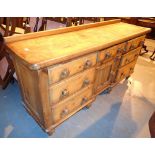 Walnut buffet sideboard with seven drawers and a central cupboard on tulip feet 180 x 52 x 87 cm H