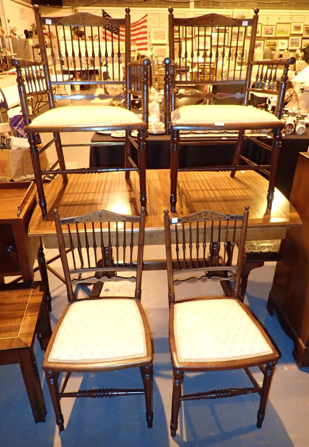 Four upholstered inlaid stickback chairs including two carvers