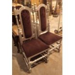 Pair of silver painted dining chairs with upholstered backs and seats