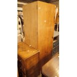 Three pieces of wooden furniture to include wardrobe and side cupboards