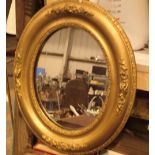 Small oval framed mirror