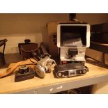 Group of vintage folding and box cameras with a tripod and Elmo editor CONDITION REPORT: