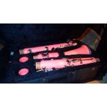 Cased pink four piece clarinet