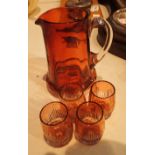 Victorian cranberry glass jug with four cordial glass