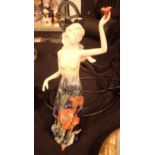Old Tupton ware figurine of a young woman holding a flower