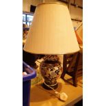 Oriental type ceramic based table lamp with shade