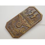 SS Day badge in pressed brass