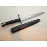 K9 bayonet in a plastic sheath blade mar