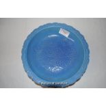 A Chinese porcelain turquoise ground plate with dragon decoration, 22cm diameter.