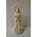 A Chinese blanc de chine figure of Guanyin, three figures moulded as one, 41cm.