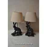 A pair of modern table lamps modelled as hares, with cream shades, 54cm overall.