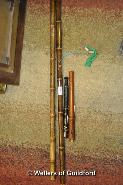 Two Chinese bamboo end flutes, the longest 84.5cm, a small woodwind instrument and a recorder (4).