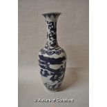 A Chinese blue and white vase with slender neck, decorated with figures in a garden, 31cm.