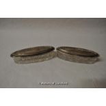 A pair of oval hobnail cut glass pin dishes with silver lids, Birmingham 1912.