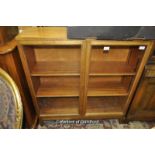 A mid 20th Century glazed display cabinet with two door, 91cm wide; together with a mahogany