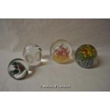 Four glass paperweights, one modelled as an owl, the smallest signed indistinctly.