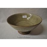 A stoneware footed bowl by Richard Batterham, green glaze with impressed fluted decoration, 11cm.